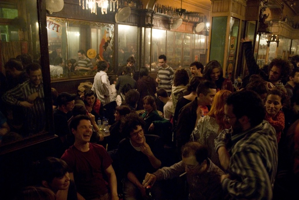 People have fun on Friday night at Bar Marsella, the temple of the absinthe drink in Barcelona