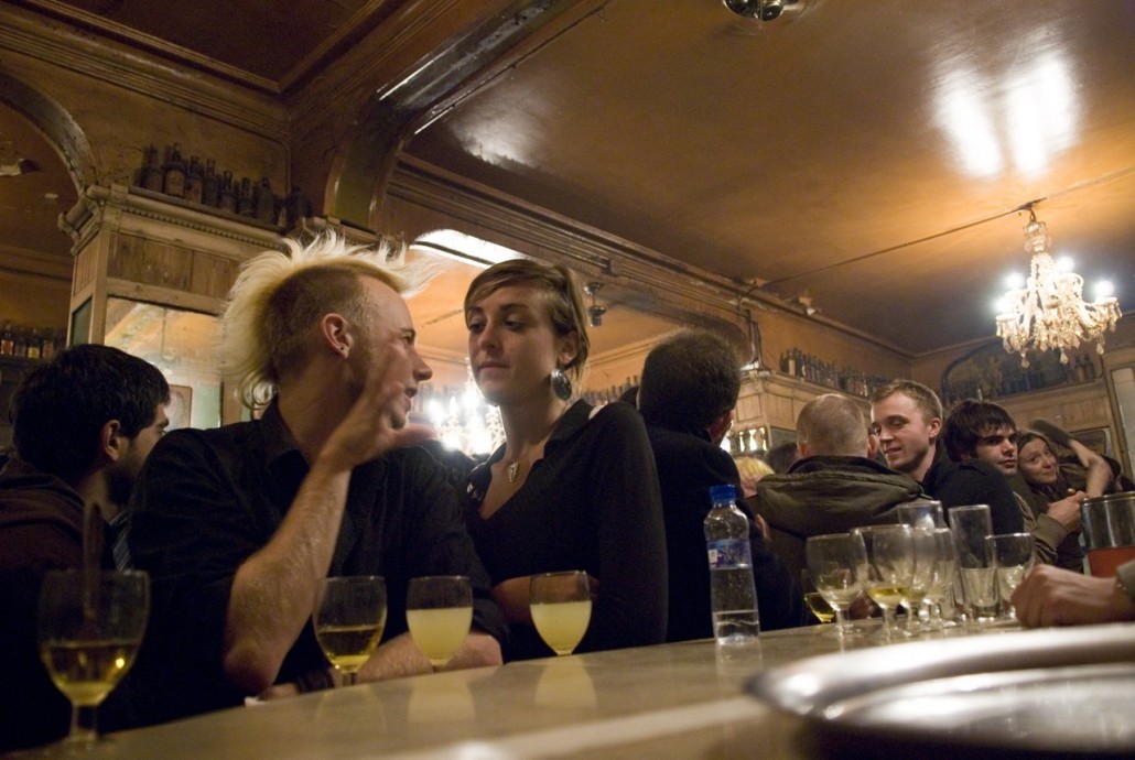 People have fun on Friday night at Bar Marsella, the temple of the absinthe drink in Barcelona